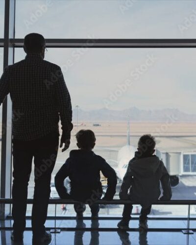 parent and two children at the airport