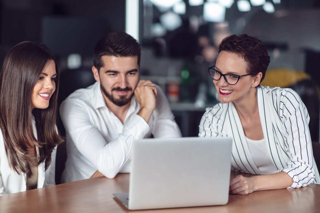 Couple meeting financial adviser for home investment contract